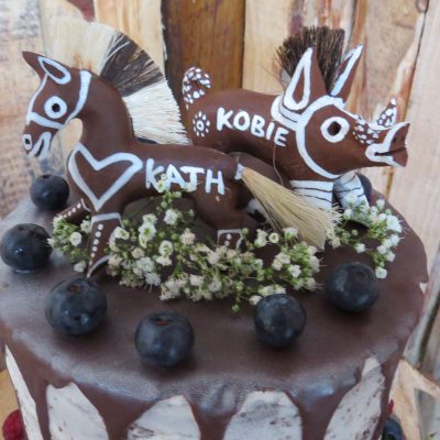 Unique cake topper using Hogsback's own special Hogs and Horses - made by locals