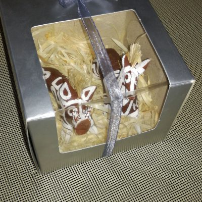 Hand-crafted hogs and horses in a gift box